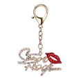 Detail view of gold keychain featuring red crystal lips and Sugar Baby diamond letters - Lips (Sexy)