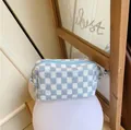 Knitted blue and white checkerboard cosmetic bag with zipper closure and woven texture - Blue & White Plaid