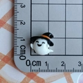 Miniature white resin ghost figurine with black wizard hat on a metric measuring mat - White Ghost with Black Hat