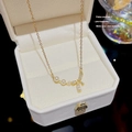 18K gold plated bow necklace with shimmering rhinestones and three white pearls - X346 Gold Bow Pearl Zirconia