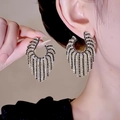 Elegant long tassel earrings with black and clear stones for party wear - Black & White Zirconia Curved Tassel (522)