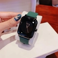 Green silicone strap watch with black square dial shown on wrist with cat-eye nails - Dark Green Strap Gunmetal Case