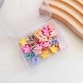 Close-up of colorful flower-shaped mini hair claws in a transparent storage box - 4-Small Flower 20pcs Mixed Colors
