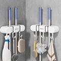 White wall-mounted mop holder with dual suction clips and hooks for broom storage - 2 Clips 3 Hooks Cream White 2Pcs