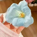 Light blue tulip fabric hair scrunchie with delicate silk texture and floral petals - Blue Open Tulip Hair Clip