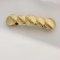 Golden spring hair clip with five round metal plates and radial brushed texture - Ribbed Disk Chain Gold