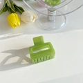 Close-up of light green rectangular hollow hair claw clip with tulips decoration - 5cm / Bright Green