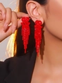 Elegant red heart-shaped rhinestone long tassel earrings shown on a female model - Red Heart Shape Rhinestone Tassel