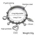 Adjustable stainless steel wire bracelet with heart, wing charms and IP gold plating - B-Steel Rhinestone Heart Style