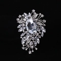 Macro shot of silver alloy brooch with crystal rhinestones on black velvet background - MM-BR-0028 / Silver