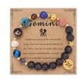 Bracciale Gemini sistema solare con pietre vulcaniche e ciondoli dorati su cartoncino - Gemelli