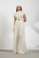 Detailed view of intricate floral lace texture on white wide-leg trousers and matching top - Milky White