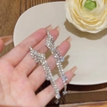 Elegant long tassel drop earrings with silver wavy design and sparkling zircon inlays - Silver Wave Zirconia