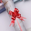Macro shot of red pull bow with heart patterns for festive gift wrapping decoration - Red Heart