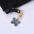 Cute blue enamel butterfly pendant with gold heart clasp on a black zipper pull - Blue Light Blue Butterfly