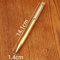 Bamboo shaped vintage brass metal business pen in gold finish on wood desk surface - Twist Action Pen