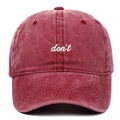 Vintage washed burgundy baseball cap with white embroidered don't text in front view - Burgundy