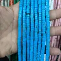 Close-up of blue marble textured cylindrical natural stone spacer beads for DIY jewelry - Blue Vein Turquoise