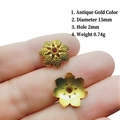 Detailed macro view of 15mm antique gold flower bead caps with engraved leaf textures - 4# Antique Gold