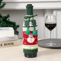 Knitted Christmas wine bottle cover with snowman pattern and pompom drawstring detail - Snowman