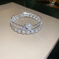 Close-up of silver layered bangle featuring brilliant zircons and elegant white pearls - 4# Bangle-Silver-Large Pearl Zirconia Style