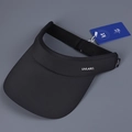 Detailed close-up of UPF 50+ label on black sun visor with UVLABEL logo and cool knit fabric - M (56-58cm) / Black