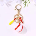 Baseball keychain with red shoes, wooden bat, and classic ball pendant on a golden ring - Gold Baseball Bat Sneaker Style