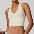 Nahtloser cremeweißer Halter-Yoga-BH mit Rippsaum für sportliche Fitnessbekleidung - S / Oberteile / Beige