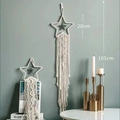 Detailed view of hand-woven cotton star macrame wall hanging with long tassels and fringes - Beige Star with Pendant