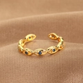 Golden Evil Eye open ring with blue crystal stones on textured brown fabric - Evil Eye Chain Link Style (Q-J080) / Gold