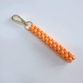 Handmade woven key ring in vibrant orange with golden metal spring clasp hook - Orange
