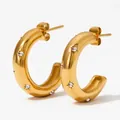 Golden C-shaped hoop earrings featuring starburst engravings and clear zircon inlays - White Zirconia Starburst Style(KDE1391) / Gold