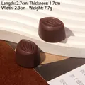 Detailed view of resin chocolate dessert miniatures showing 2.7cm size and striped texture - Almond - Dark Coffee