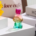 Close-up of a translucent gradient colored resin rabbit figurine on a white minimalist block - Zodiac Rabbit / Rainbow Gradient