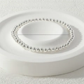 Polished silver beaded stretch bracelet featuring 4mm metal beads with a 17cm inner diameter - 4mm / Silver