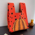 Orange knitted tote bag featuring black polka dots and a festive pumpkin pattern - Pumpkin Bag - Orange