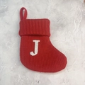 Red knitted Christmas stocking with white letter J embroidery and hanging loop - Letter J