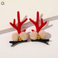 Detailed view of red reindeer antler hair clips with plush balls and gold bells - Christmas Antler Hair Clips - Beige Pom Bell
