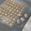 Golden flower nail stickers with colorful rhinestones on a minimalist grey background - Gold Five-Petal Flower (CO-372 Gold)
