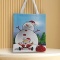 Detail view of festive Christmas canvas tote bag with Santa Claus and snowman prints - Style 6