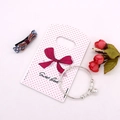 Silver bangle bracelet with hollow bell charm and square pattern beads on pink card - No. 11 (Pink Polka Dot)
