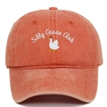 Close-up of Silly Goose Club embroidery on washed cotton vintage baseball cap - Orange