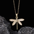 Detailed view of dragonfly pendant with white enamel wings and sparkling zircon pavé - Style E-Gold White Enamel