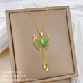Macro view of green butterfly pendant necklace with gold tassels and cubic zirconia details - Golden Butterfly Style (G540)