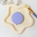 Portable matte purple round folding makeup mirror shown on a cream star tray - 65mm / Purple