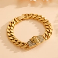 Macro detail of golden Cuban link bracelet featuring a skull charm with micro-pave diamonds - Gold Skull Head Style (D820)