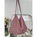 Pink canvas tote bag featuring black bow patterns on a modern acrylic chair - Pink with Black Bow(21#)