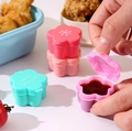 Mini flower-shaped sauce containers in pink and purple for bento box seasoning - Flower Shape Sauce Boxes