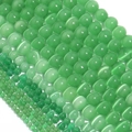 Macro shot of green cat eye stone beads in various sizes for DIY jewelry crafting - 4mm (Approx 90pcs) / Green