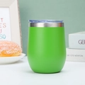 Grass green 12oz stainless steel wine tumbler with lid on a minimalist dining table - 12oz / Fruit Green